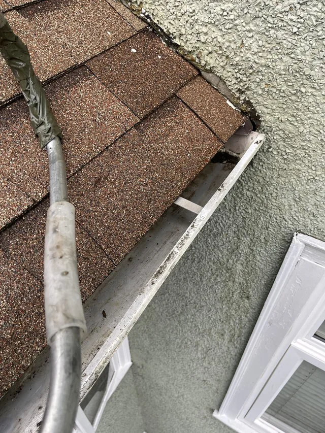 After cleaning: a clearer gutter at the roof corner.