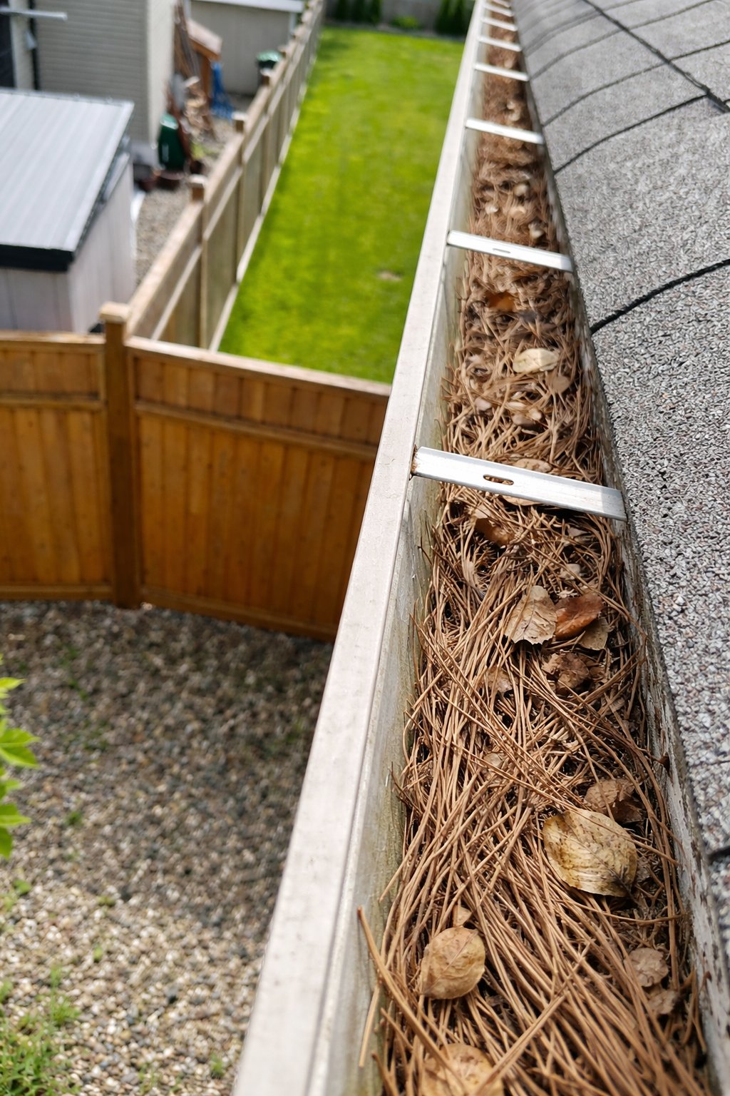 Gutters packed with debris before cleaning